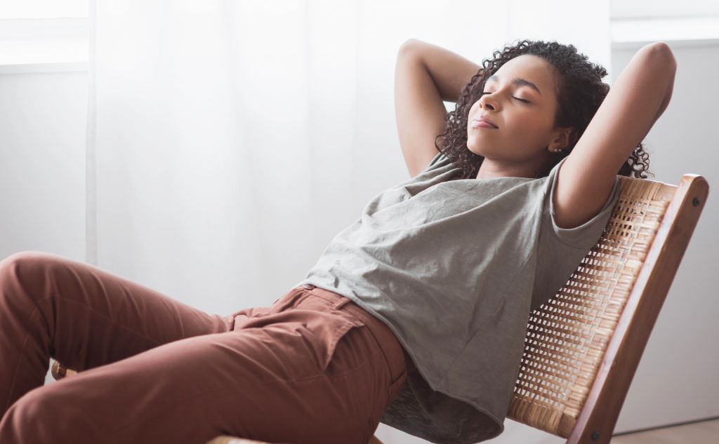 a woman resting on a chair